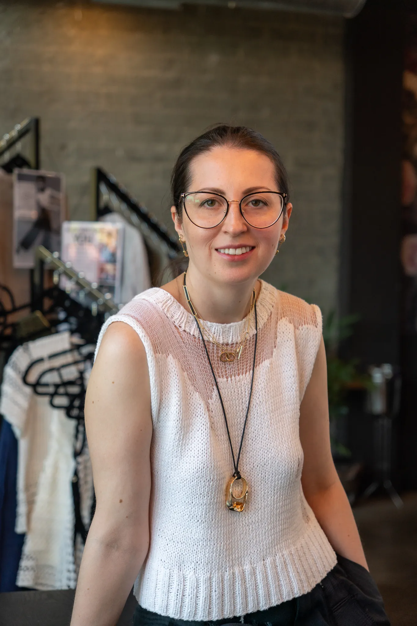 Portrait of Libby Tolm, founder and knitwear designer behind Looking Friday, wearing a handcrafted white knit top.